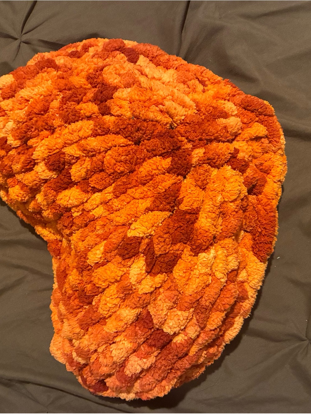 orange + black fuzzy pillow